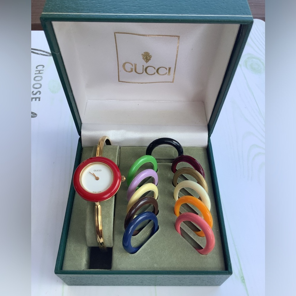 Gucci Gold Bangle Watch with Red Dial and Multicolor Interchangeable Bezels